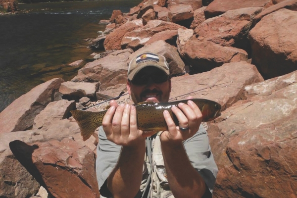 man holding a caught fish